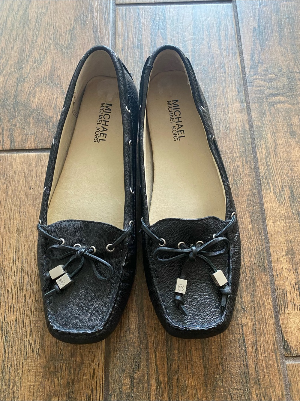 MICHAEL Michael Kors Black Leather Moccasin Loafers with Bow and Metal Accents